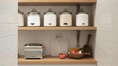 classic white kitchen pantry with food jars